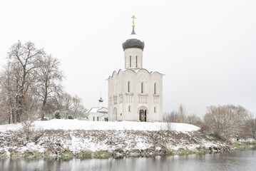 Fototapeta na wymiar Church of the Intercession on the Nerl. Built in 12th century.Winter landscape. Bogolyubovo, Vladimir region, Golden Ring of Russia
