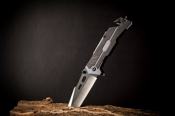 sharp steel knife on a dark background