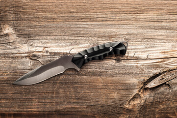 steel sharp knife on wooden background
