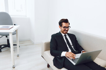 Video man business sofa laptop call home