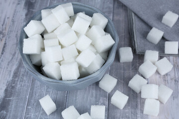 Sugar cubes in blue bowl