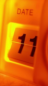 Vertical video of Flipping date numbers on a flip clock