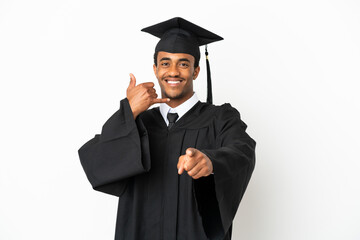 African American university graduate man over isolated white background making phone gesture and pointing front