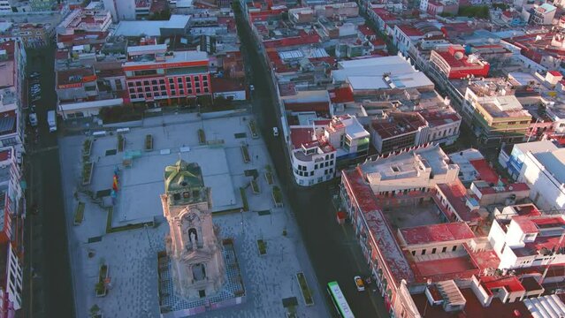Mexico, Pachuca: Aerial view of capital city of Mexican state of Hidalgo at sunrise, Monumental Clock (Reloj Monumental de Pachuca) - landscape panorama of Latin America from above