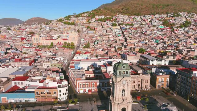 Mexico, Pachuca: Aerial view of capital city of Mexican state of Hidalgo at sunrise, Monumental Clock (Reloj Monumental de Pachuca) - landscape panorama of Latin America from above