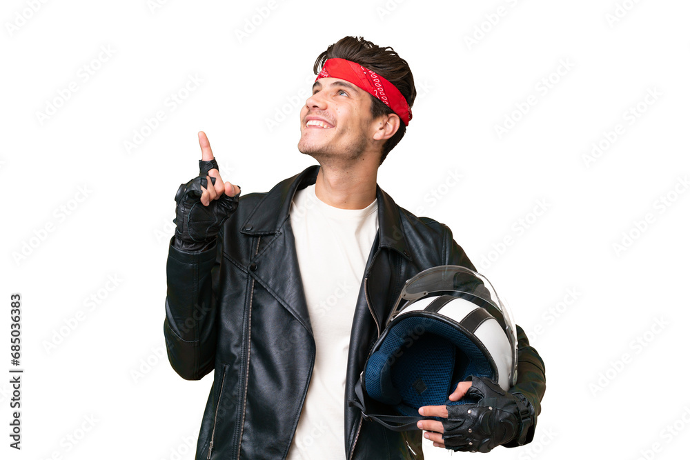 Wall mural Young caucasian man with a motorcycle helmet over isolated background pointing up a great idea