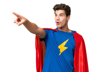 Super Hero caucasian man over isolated background pointing away © luismolinero