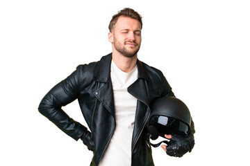 Young caucasian man with a motorcycle helmet over isolated chroma key background suffering from...