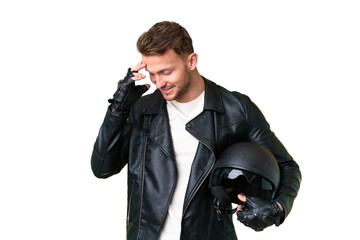 Young caucasian man with a motorcycle helmet over isolated chroma key background laughing
