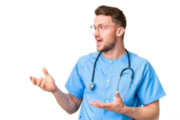Young nurse man over isolated chroma key background with surprise facial expression