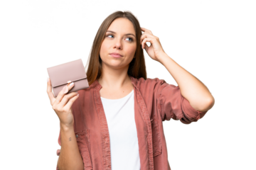 Young blonde woman holding a wallet over isolated chroma key background having doubts and with confuse face expression