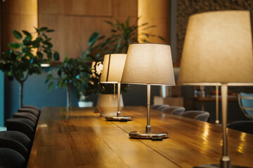 modern interior warm lights on long wood table