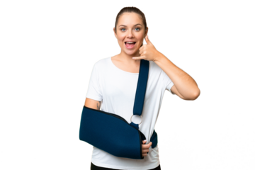 Young blonde woman with broken arm and wearing a sling over isolated chroma key background making phone gesture. Call me back sign