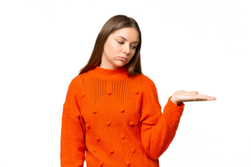 Young blonde woman over isolated chroma key background holding copyspace with doubts