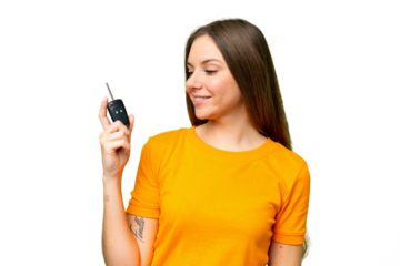 Young woman holding car keys over isolated chroma key background with happy expression