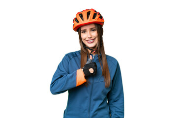 Young cyclist woman over isolated chroma key background giving a thumbs up gesture