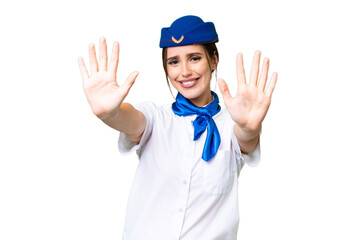 Airplane stewardess over isolated chroma key background counting ten with fingers