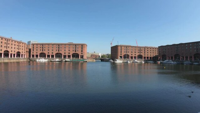 Liverpool, England, September 9, 2023: PAN SLOW The Royal Albert Dock is a complex of dock buildings and warehouses in Liverpool. Designed by Jesse Hartley and Philip Hardwick, it was opened in 1846.