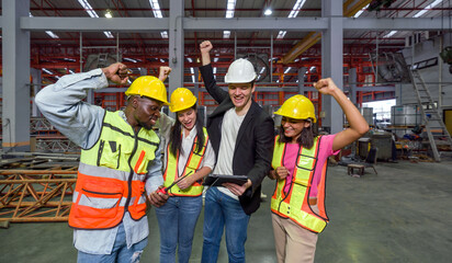 Celebrating Success. Hardhat construction worker raising their hand high, marking a victorious moment.