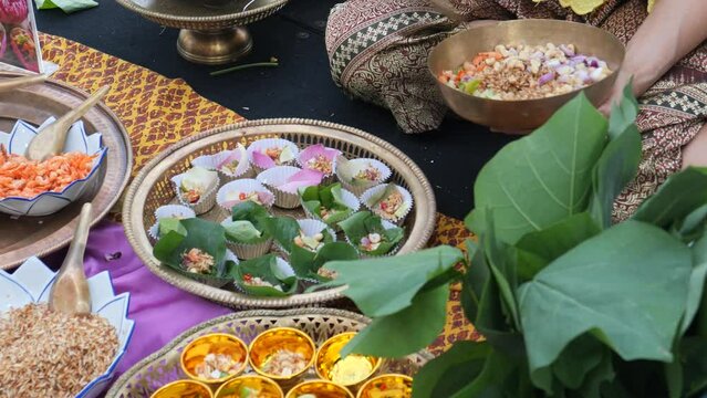 Making Miang Kham (traditional Southeast Asian snack from Thailand and Laos), Traditional Thai snack. It&rsquo;s a snack containing different ingredients of herbs and vegetables. 