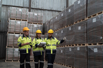 Warehouse concept. Group of male and female warehouse workers working in storage warehouse