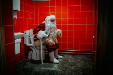 Santa Claus sitting in the toilet bowl pooping