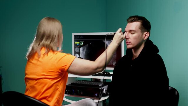 An ophthalmologist performs a precise ultrasound of the eyes (B-scan) for an in-depth examination of the eyes in a clinical setting. Medical technology concept for ophthalmic services.