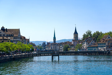 Scenic view of the old town of City of Zürich with Limmat River in the foreground on a hot sunny summer day. Photo taken July 11th, 2023, Zurich, Switzerland.