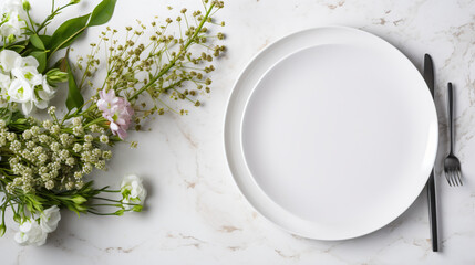 Table setting with white plate flowers