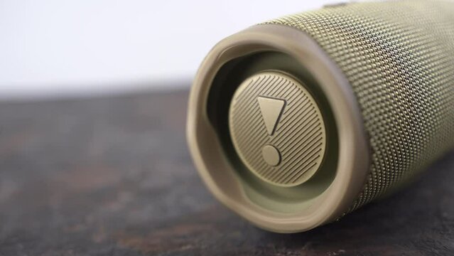 Ukraine, Dnipropetrovsk 03.11.2021 JBL Portable Bluetooth Speaker. The speaker membrane in the sound column while playing music. Close-up footage of portable speaker.