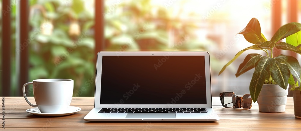 Poster detailed perspective of cozy workspace with empty laptop screen and office materials copy space imag