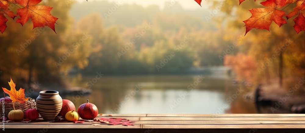 Poster Fall themed table with red and yellow leaves amid forest backdrop copy space image