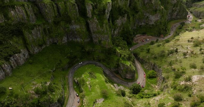 Cinematic aerial footage of picturesque landscape of the famous evergreen Cheddar Gorge in Great Britain