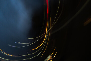 Abstract light patterns from cars at night using intentional camera movement