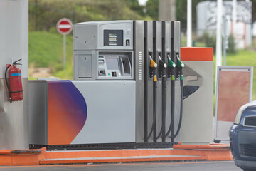 Gas Station with Parked Car - obrazy, fototapety, plakaty