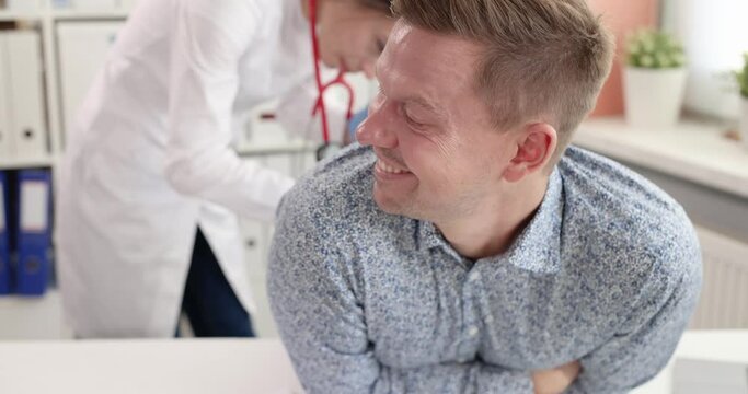 Young man at medical appointment with proctologist. Male problems with caves concept