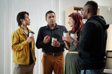 Diverse business team discussing fresh ideas in coffee break