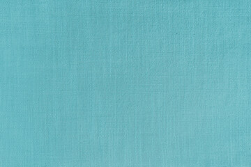 Texture background of cyan linen fabric. Textile structure, cloth surface, weaving of natural cotton fabric closeup, backdrop, wallpaper.