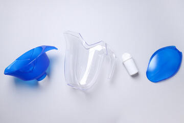 Disassembled water filter on a white background