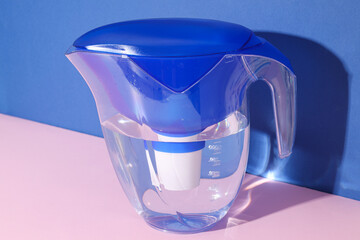 Water filter with a blue cap on a blue background
