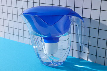 Water filter with a blue cap on a blue background