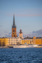 Fototapeta premium Churches, court houses and hostel ship on the island Riddarholmen, a snowy winter day in Stockholm Sweden