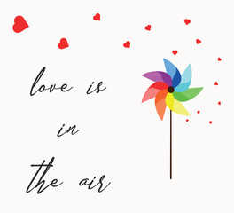 pinwheel in rainbow colors with love is in the air slogan and hearts spreading in the air