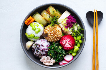 Japanese lunch with silken tofu, onigiri, spinach gomae, miso leeks ad pickled vegetables