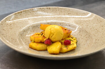 grilled pineapple with mango sorbet, served in a restaurant