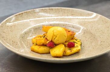grilled pineapple with mango sorbet, served in a restaurant