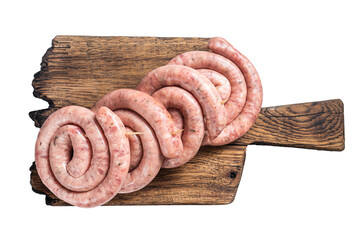 Ready for cooking Raw spiral pork meat sausages on a wooden board.  Transparent background....