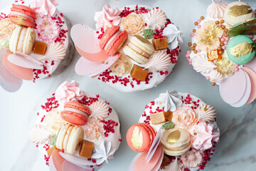 Beautiful traditional Orthodox Easter cakes decorated with glaze, meringues, chocolate, nuts, toffees, macaroons, flowers and jelly