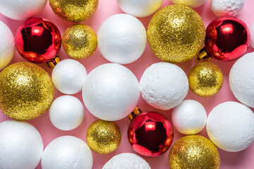 Gold and white glitter ball decoration with red Christmas bauble