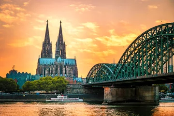Fotobehang Koln Germany city skyline, Cologne skyline during sunset , Cologne Hohenzollern bridge with cathedral Germany Europe Europe © Fokke Baarssen